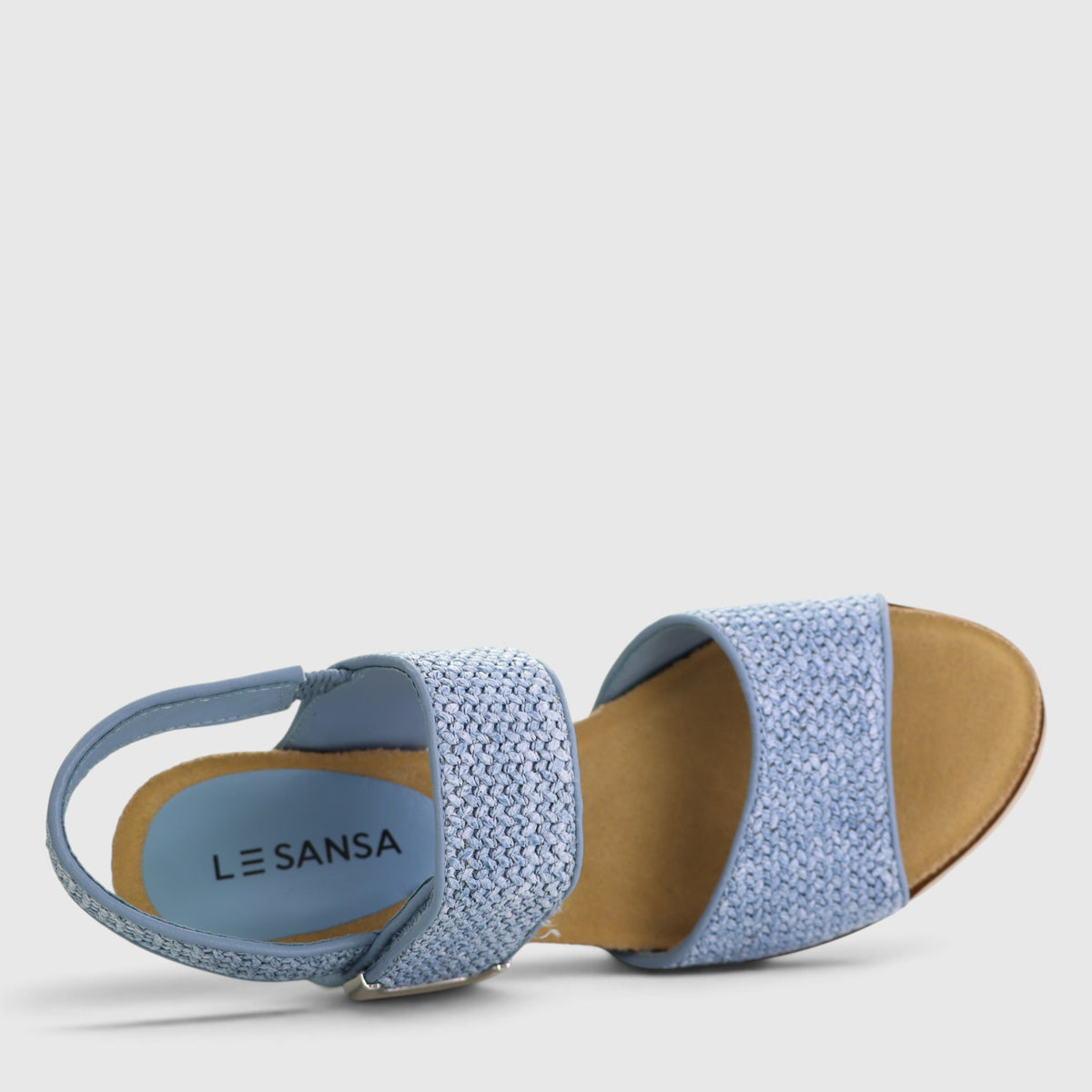 Le Sansa Evita baby blue sandals with ankle straps and open toe design, perfect for casual summer wear.