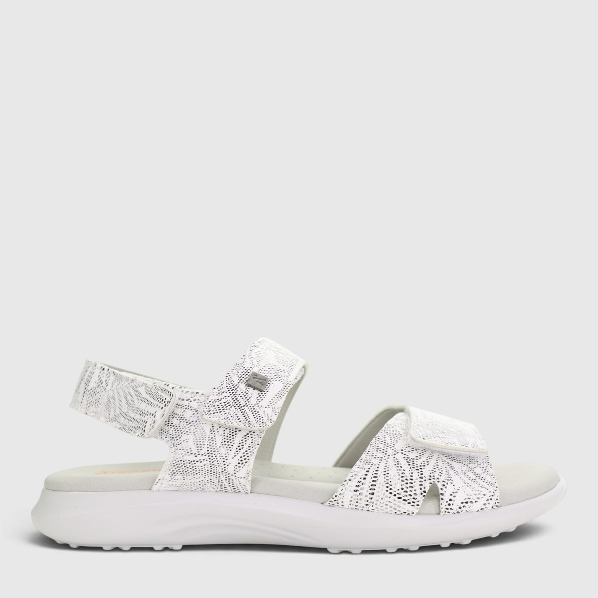 White Arcopedico Corbett sandals with adjustable straps and cushioned soles, designed for comfort and casual wear.