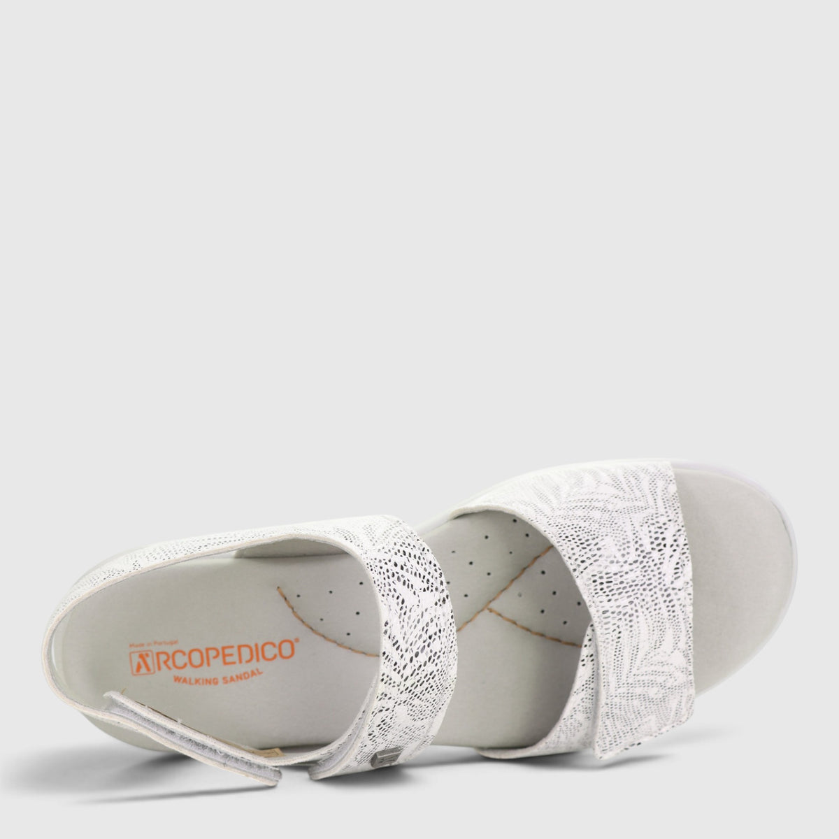 White Arcopedico Corbett sandals with comfortable straps and cushioned soles, perfect for casual wear.