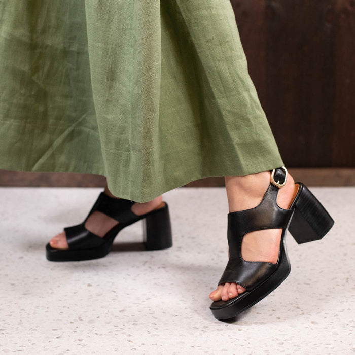 Eos Isora black sandals with adjustable straps and comfortable sole, stylish footwear for casual or summer wear.