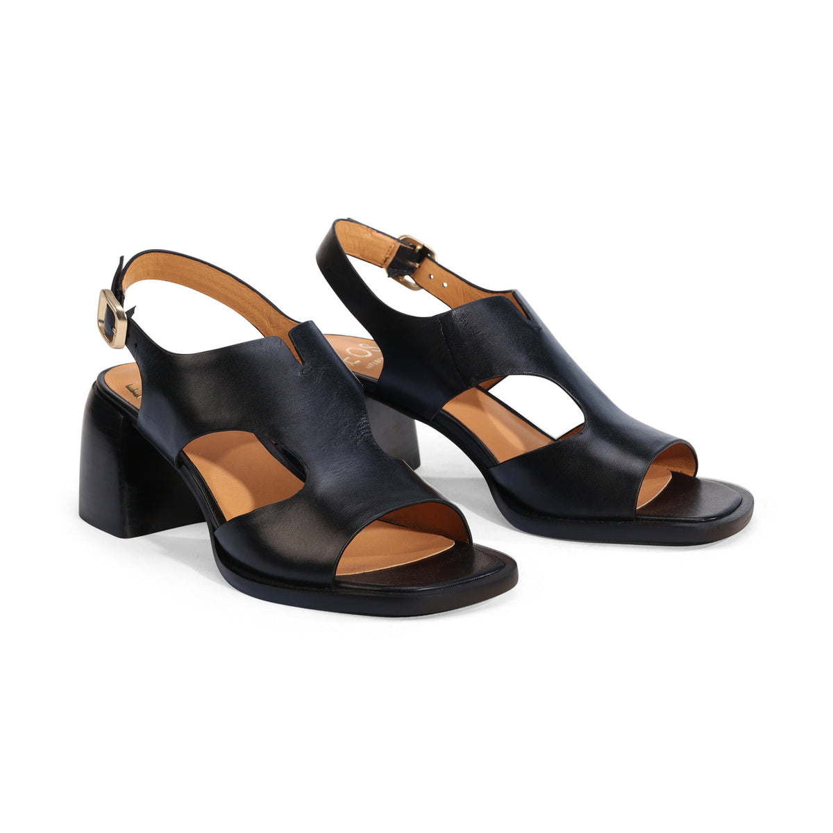Eos Isora Black sandals with black leather straps and flat soles, showcasing stylish and comfortable footwear design.