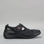 Black CC Resorts Jackie flats shown from the side, featuring a sleek slip-on design and comfortable flat sole.