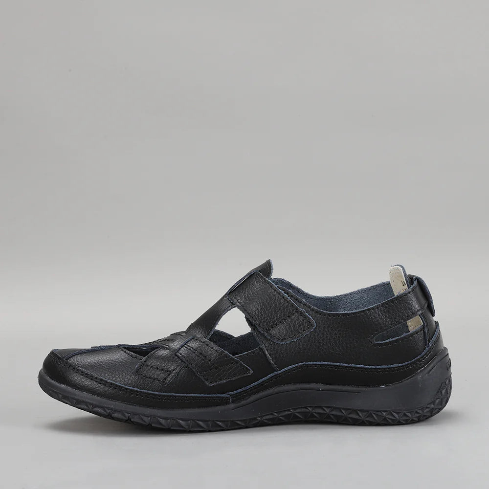 Black CC Resorts Jackie flats with pointed toe and slip-on design, perfect for casual and elegant summer wear.