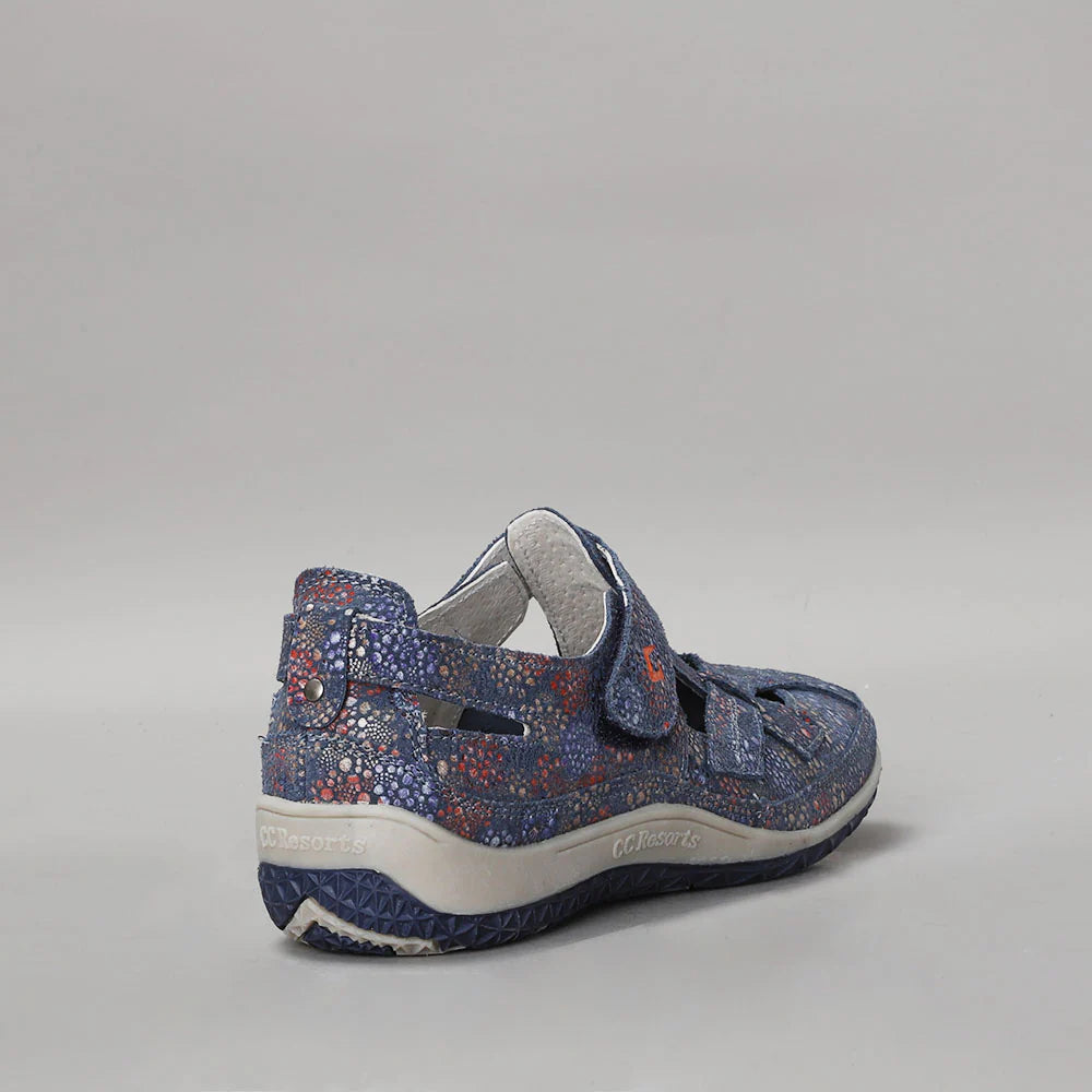 CC Resorts Jackie indigo floral flats with pointed toe and bow detail, featuring vibrant blue and floral pattern.