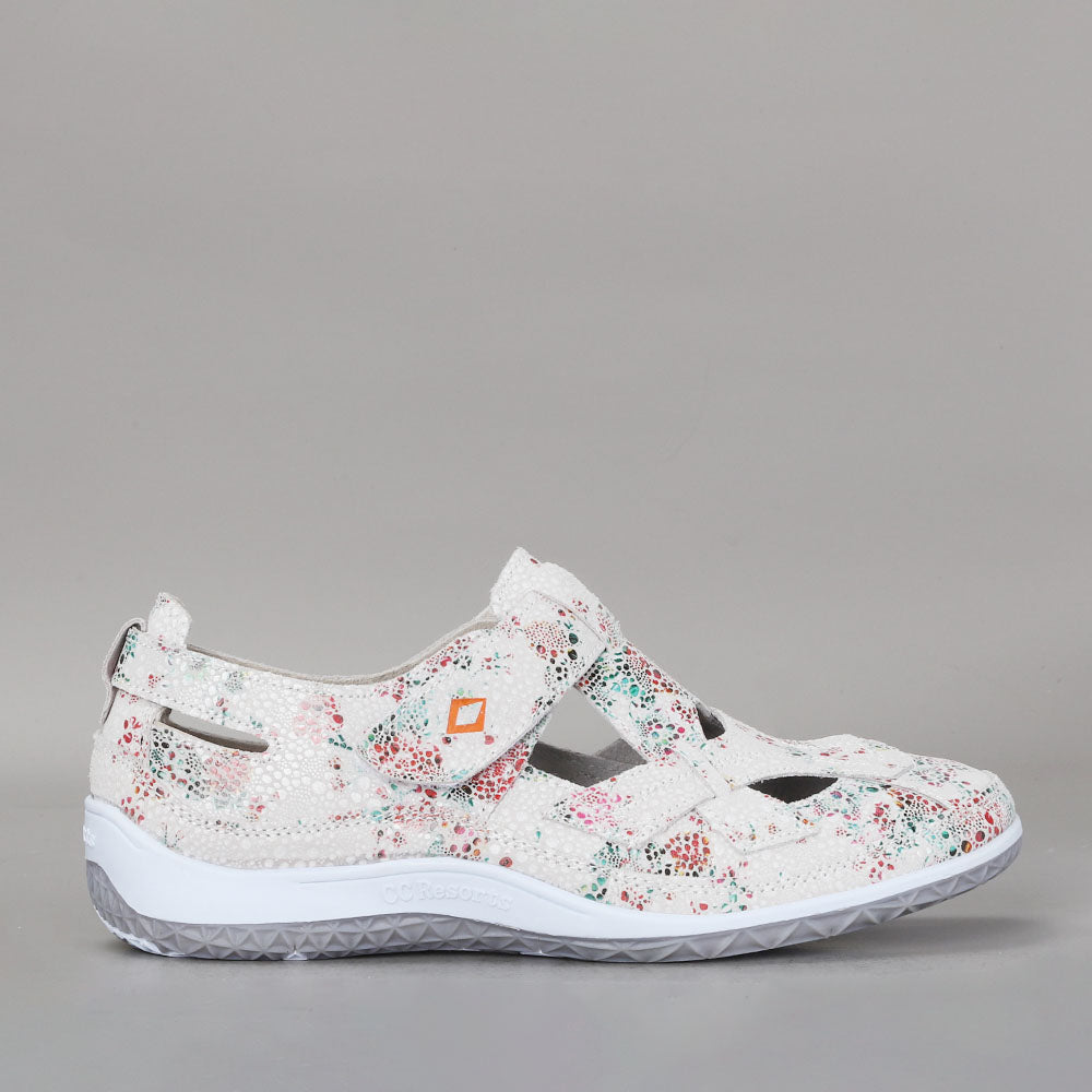 CC Resorts Jackie white and green floral flats shown from the side, featuring a stylish design and comfortable slip-on style.