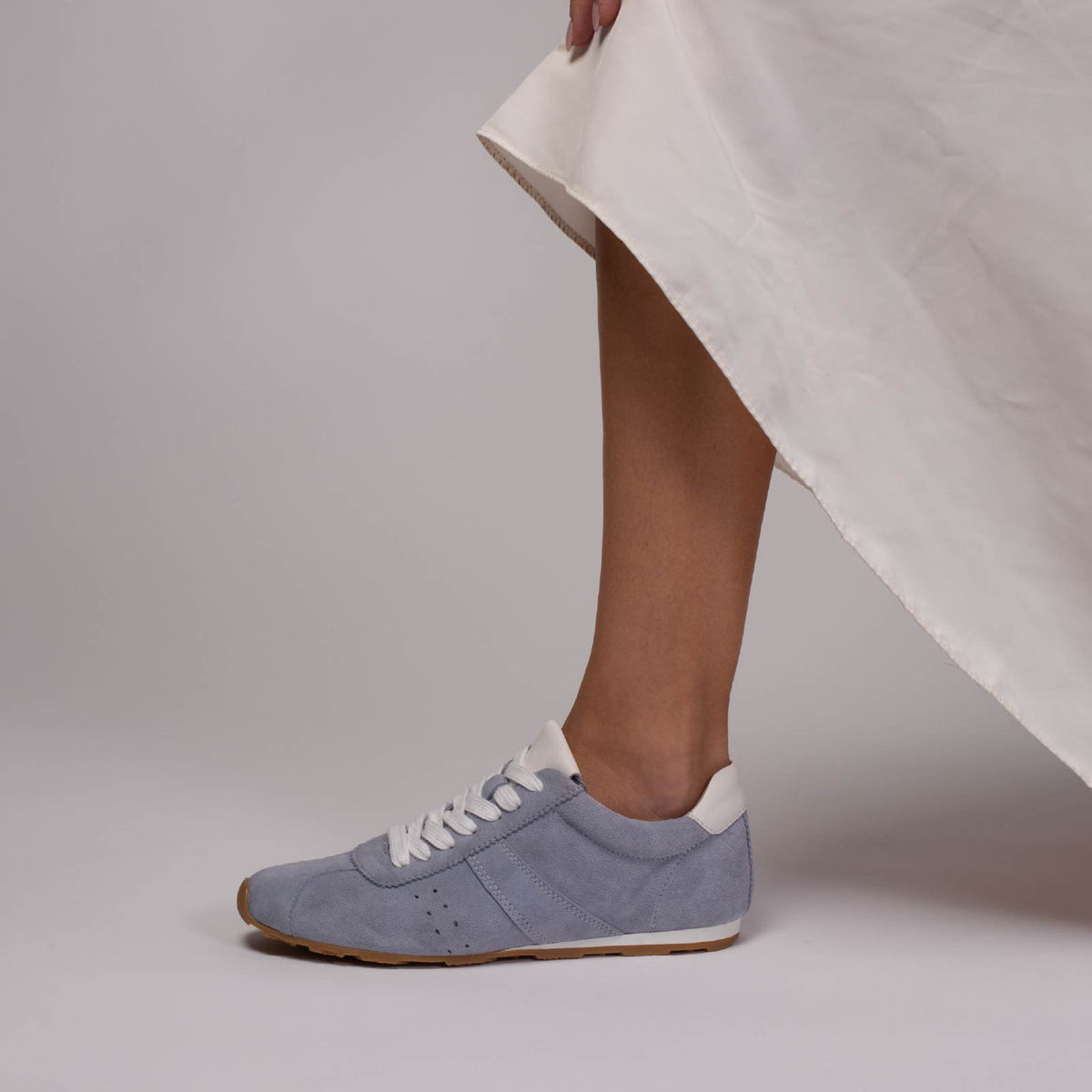 Eos Jazz Light Blue sneakers on foot, showcasing stylish light blue athletic shoes with white soles and comfortable fit.