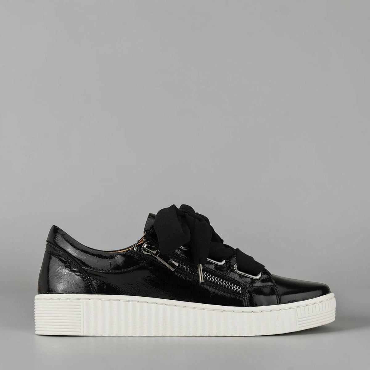 Eos Jovi black patent sneakers with crinkle finish, stylish casual footwear for everyday wear.