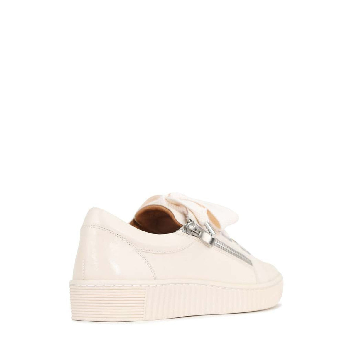 Eos Jovi Bone sneakers shown from the back, featuring a sleek design and white color with textured sole details.