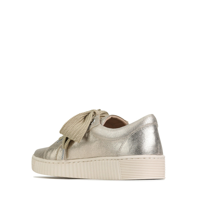 Inside view of EOS Jovi Champagne sneakers showing beige and champagne-colored interior and stylish design details