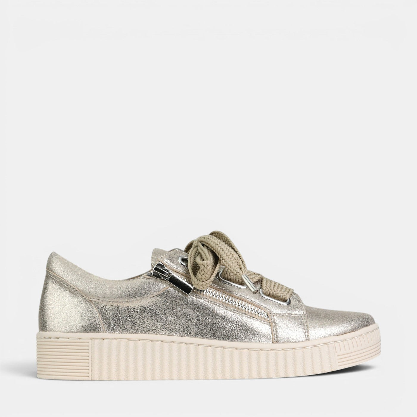 EOS Jovi Champagne sneakers outdoors, showcasing beige and champagne-colored casual shoes with white soles.