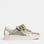 EOS Jovi Champagne sneakers outdoors, showcasing beige and champagne-colored casual shoes with white soles.