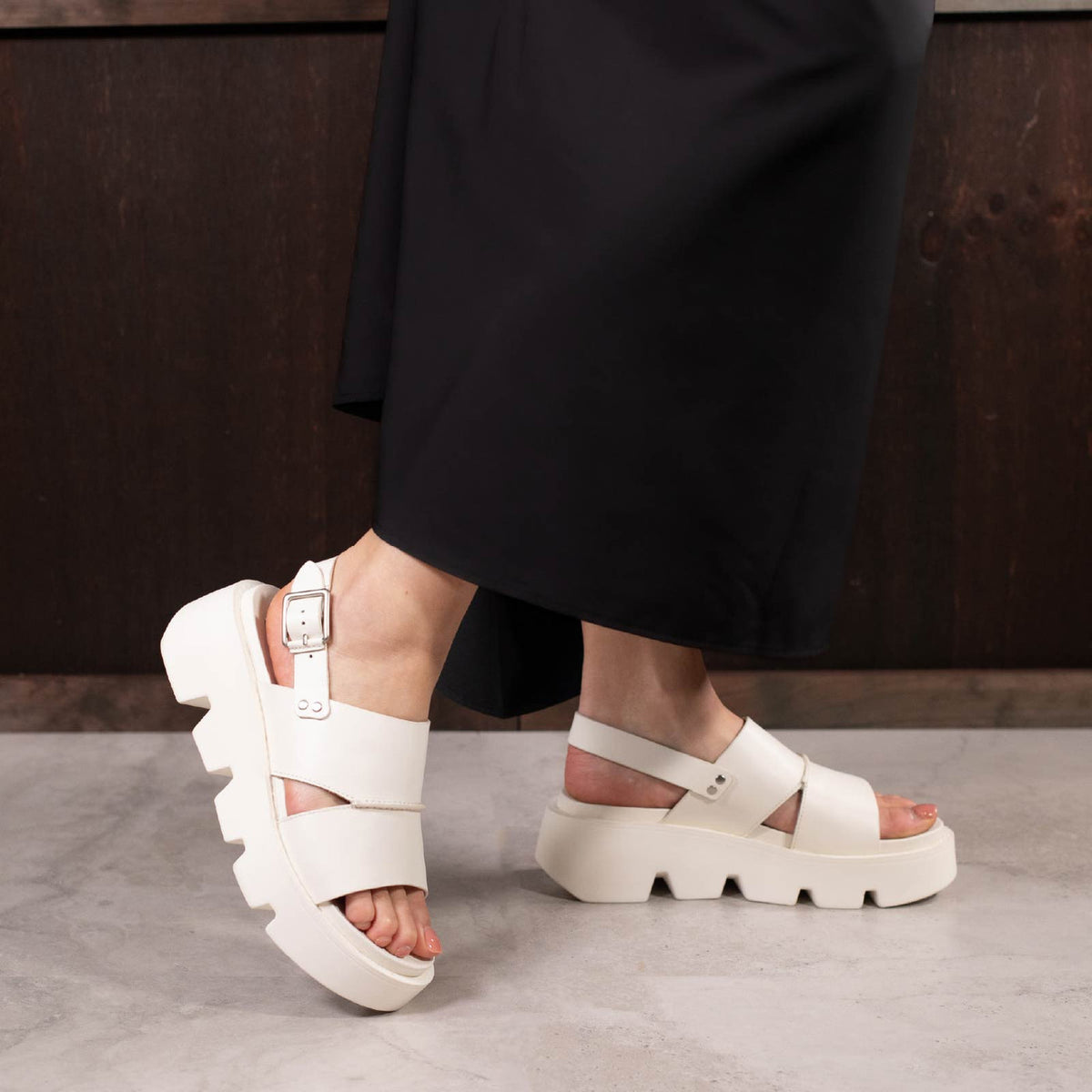 Eos Kaily Bone sandals featuring a strappy design and neutral bone color, perfect for casual warm-weather wear.
