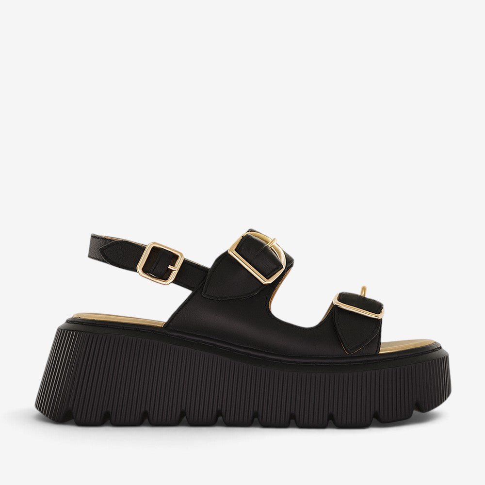 Black LE SANSA Ceno sandals with sleek straps, casual style, and comfortable sole, perfect for everyday wear.