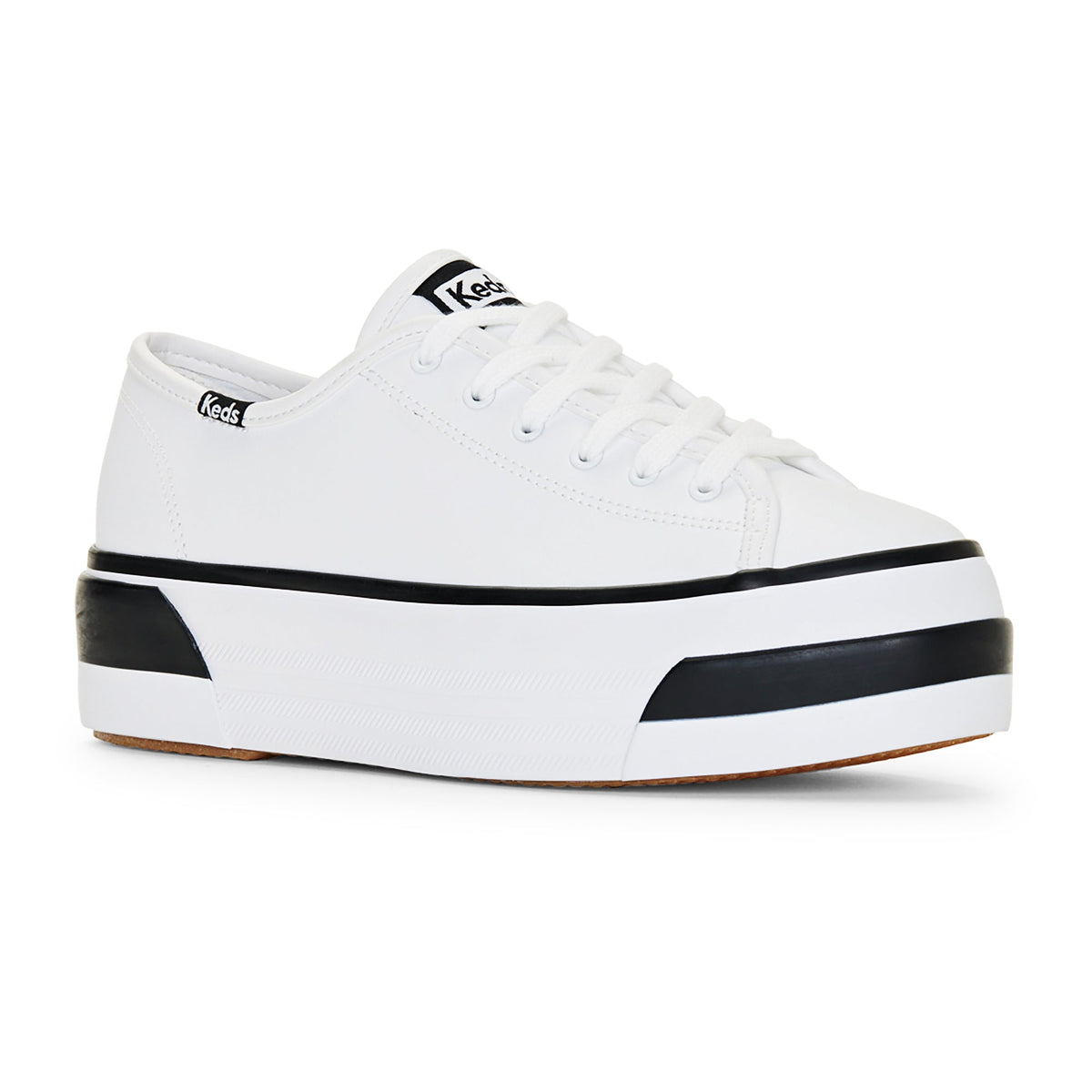 White KEDS Triple Up Bumper sneakers with padded design and casual style, featuring white laces and rubber soles.
