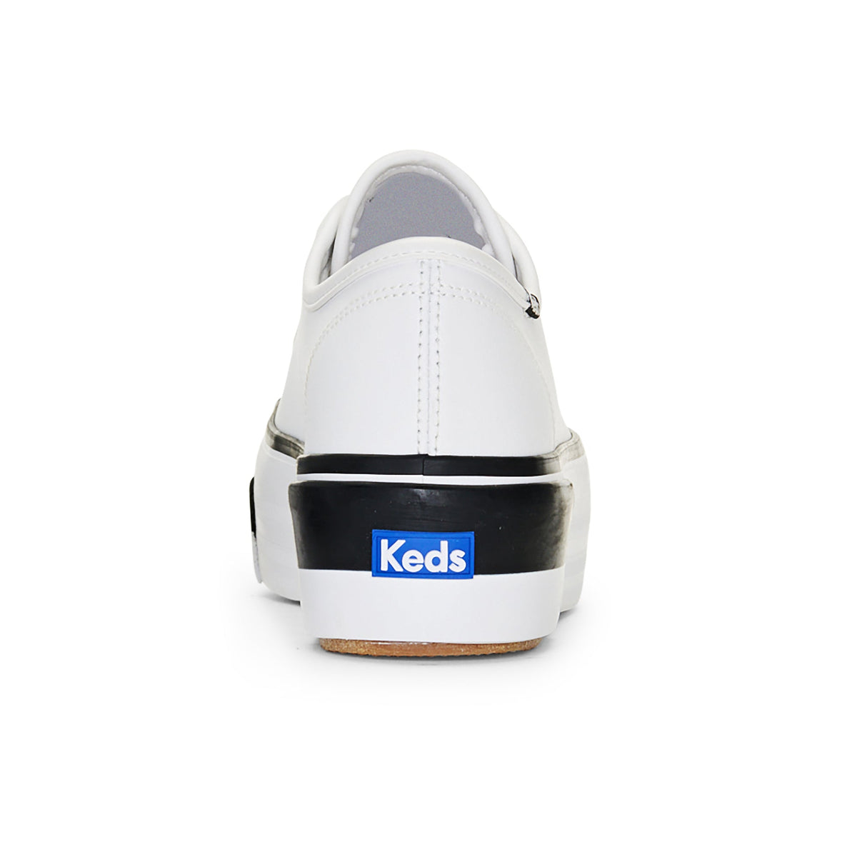 White KEDS Triple Up Bumper sneakers with a sleek design, featuring cushioned soles and stylish detailing.