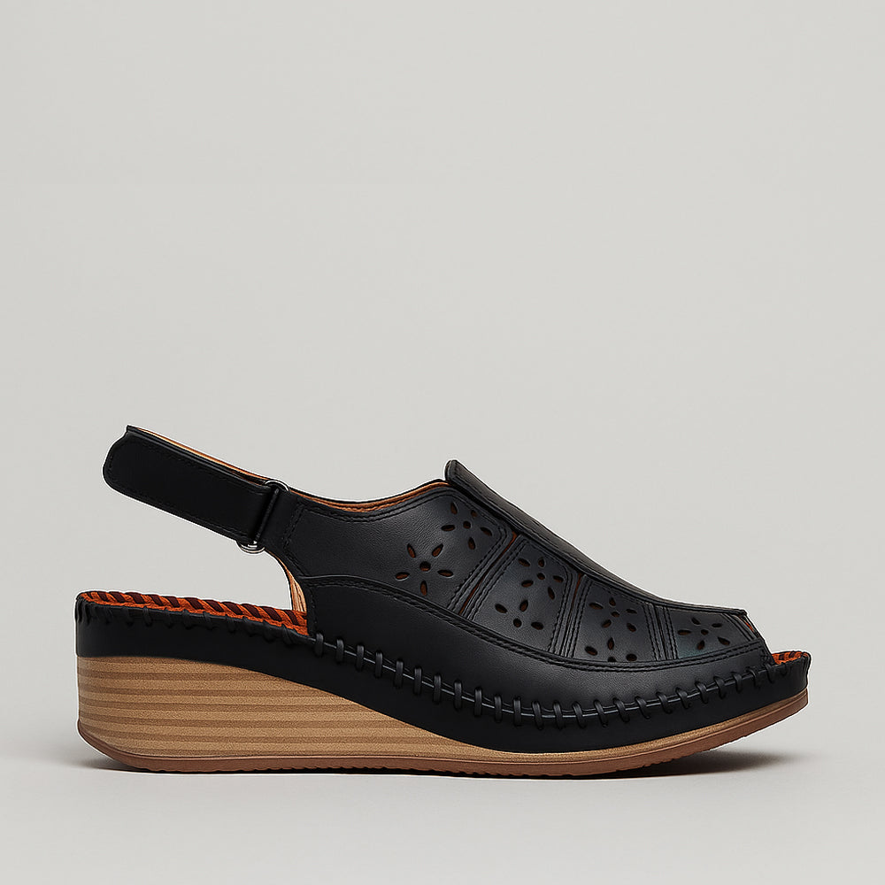 Le Sansa Kirra black sandals featuring a sleek design with adjustable straps and comfortable flat soles.
