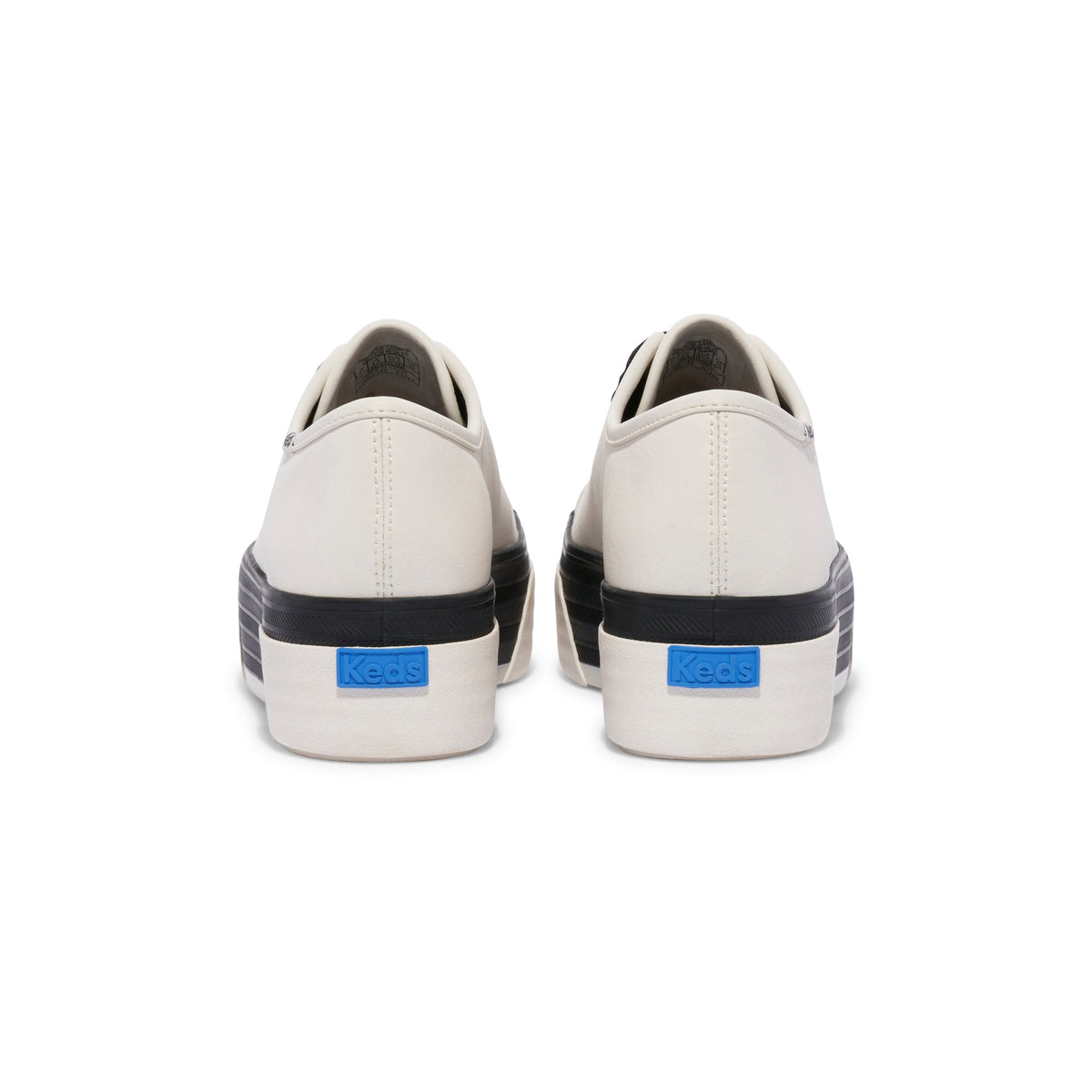 KEDS Triple Up white and black leather sneakers with chunky design and lace-up front, stylish and comfortable footwear.