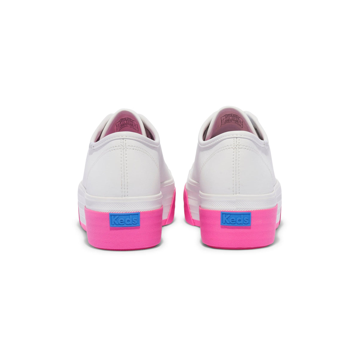 KEDS Triple Up sneakers in white and pink with leather accents, showcasing the stylish design and casual fit.