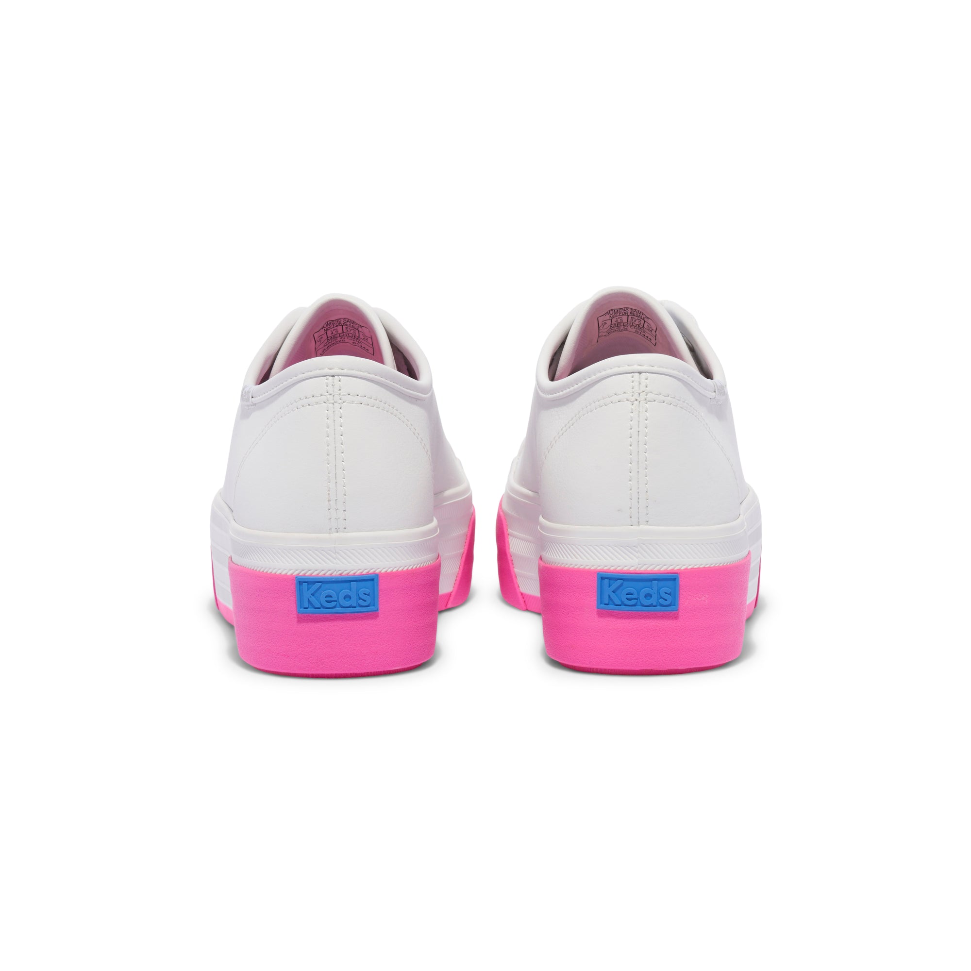 KEDS Triple Up sneakers in white and pink with leather accents, showcasing the stylish design and casual fit.