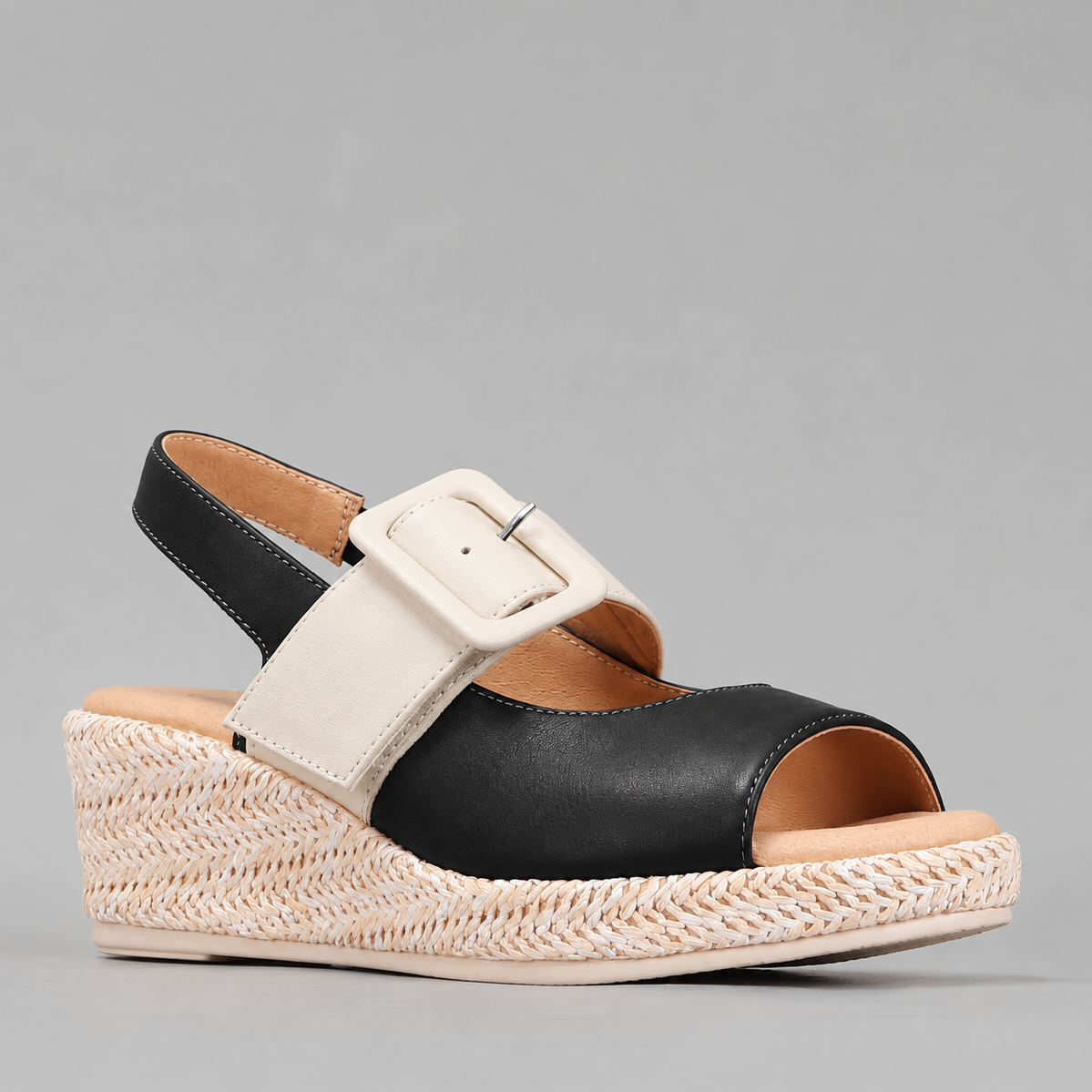 Le Sansa Parola Black Cream sandals featuring sleek black straps and a comfortable flat sole.