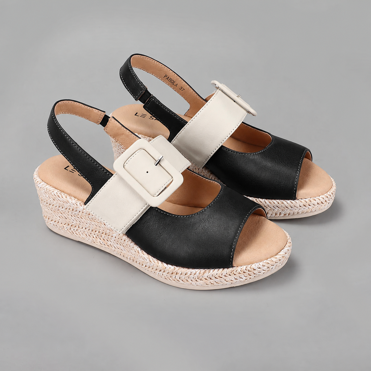 Black leather sandals from Le Sansa Parola collection, featuring a stylish strap design and comfortable sole.