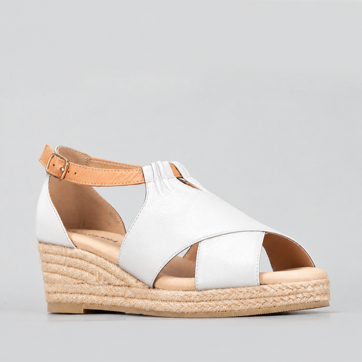 Le Sansa Pernia white and tan sandals featuring open toes and ankle straps, displayed on a neutral background.