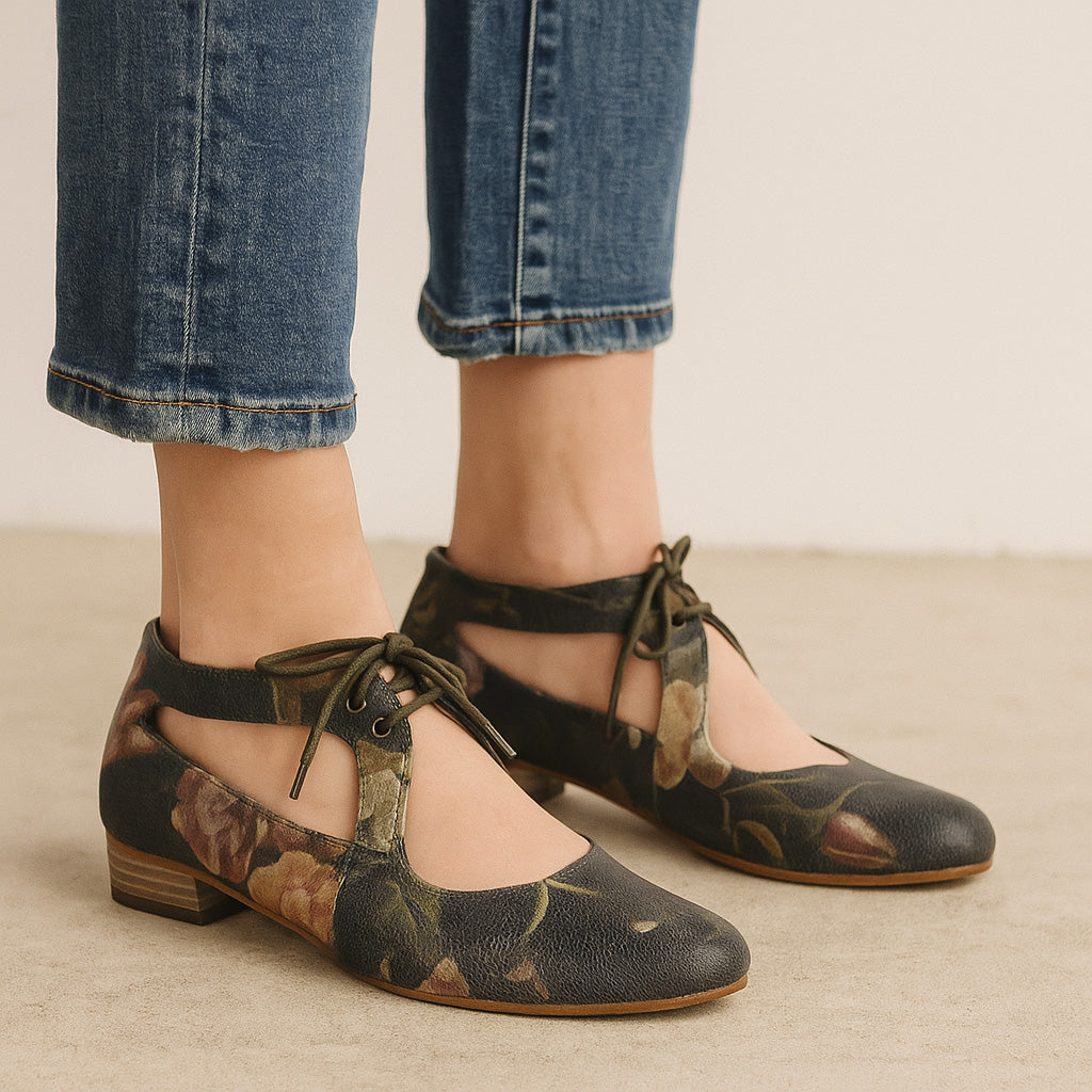 Le Sansa Boss Red floral print sandals with open toe and ankle strap, featuring vibrant red floral pattern and comfortable flat sole.