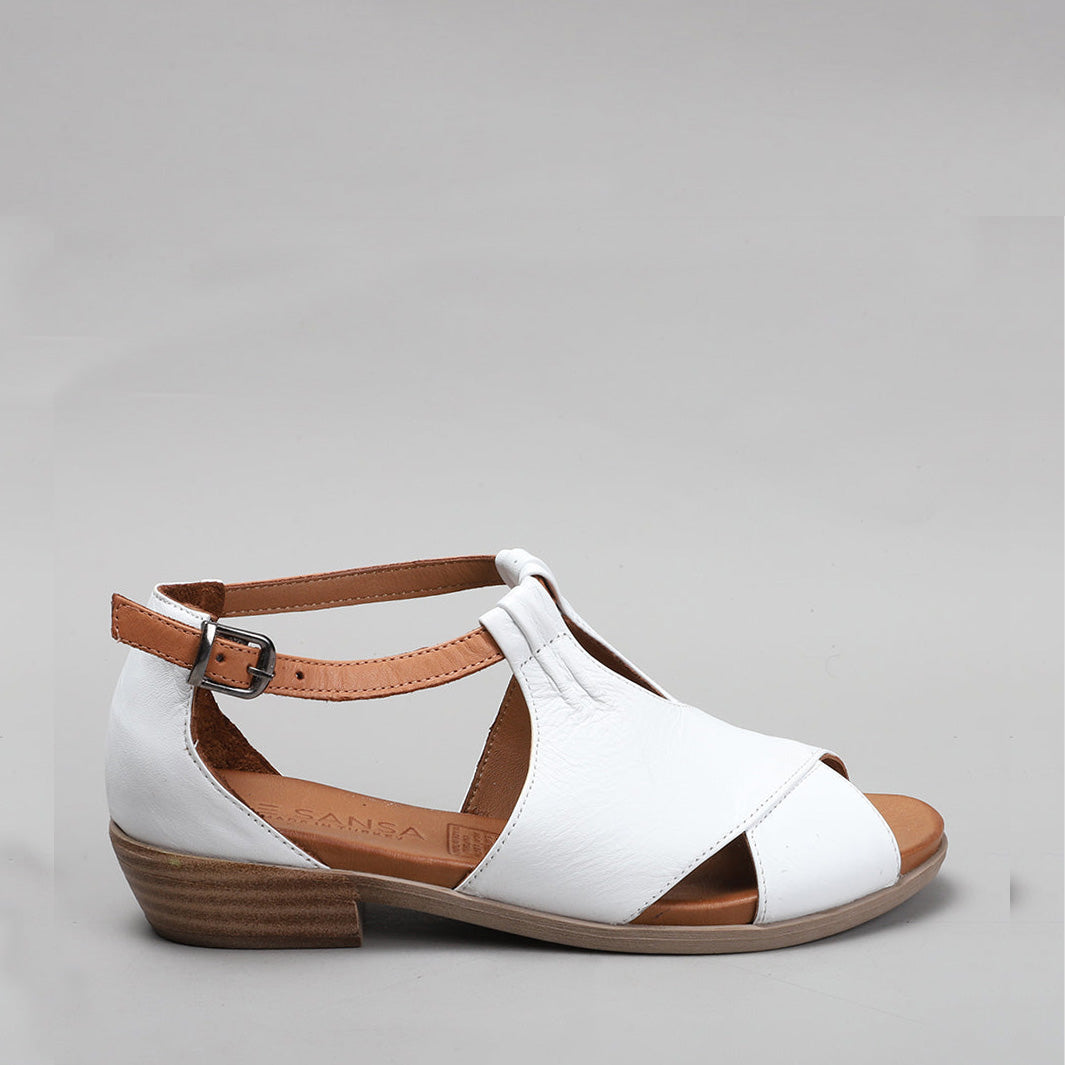 Le Sansa Digby white and tan sandals with ankle straps and open toe design, stylish footwear for warm weather.
