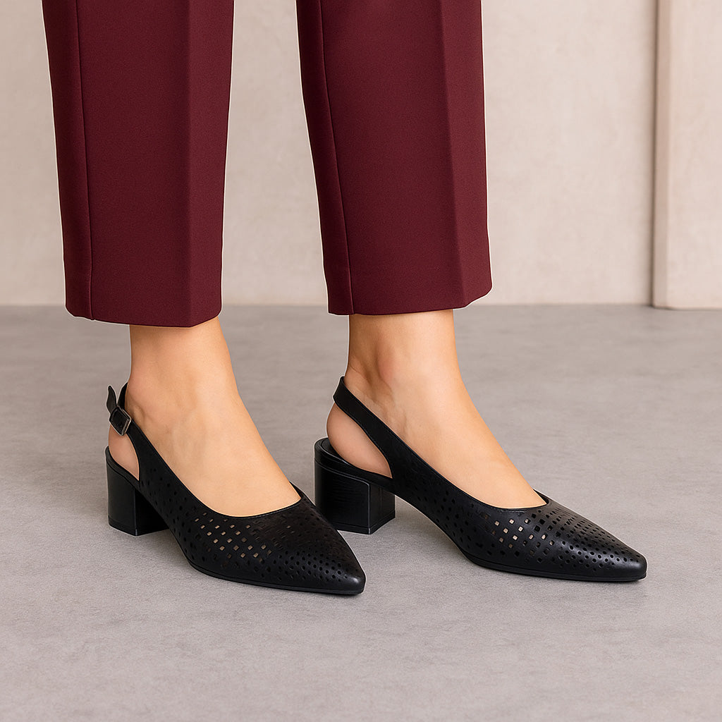 Black Le Sansa Drusilla sandals featuring open toes and ankle straps, showcasing stylish and comfortable footwear design.