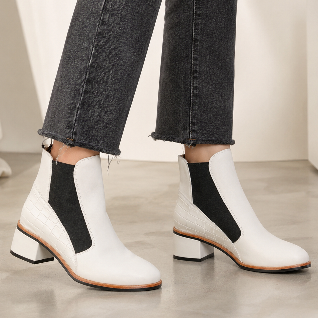 LE SANSA Refresh Bone boots featuring a sleek design, beige color, and comfortable ankle-height style.