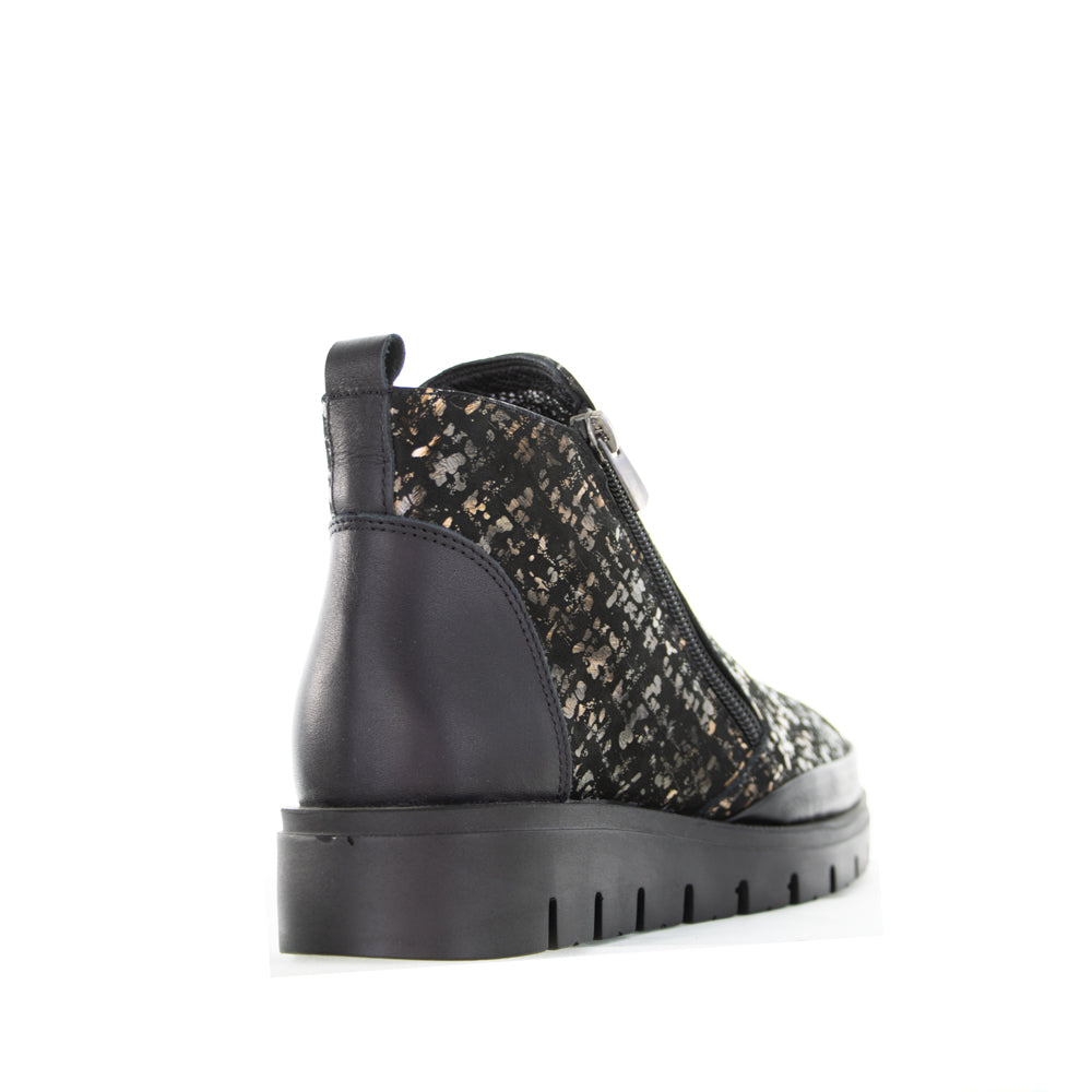 Le Sansa Rollie black print boots featuring stylish design and comfortable fit, shown in a close-up image.