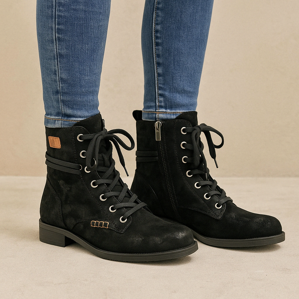 Le Sansa Rosa black print boots with stylish design and bold pattern, featuring a sleek silhouette and comfortable ankle fit.