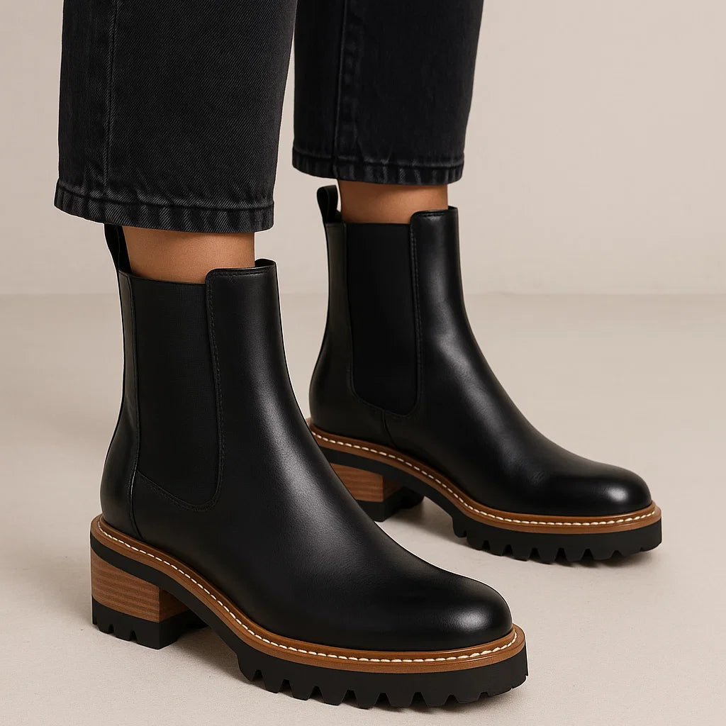 Eos Linear Black boots with sleek design and black finish, showcasing stylish footwear from the Eos brand.