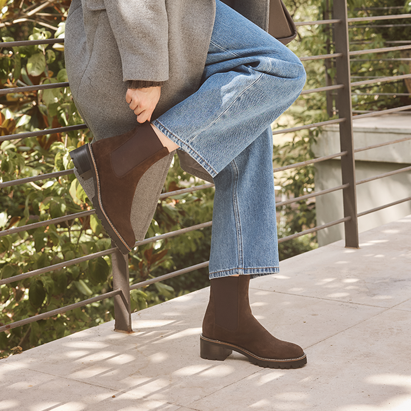 EOS Linear Chestnut suede boots with a sleek design, featuring a rounded toe and low heel on a neutral background.
