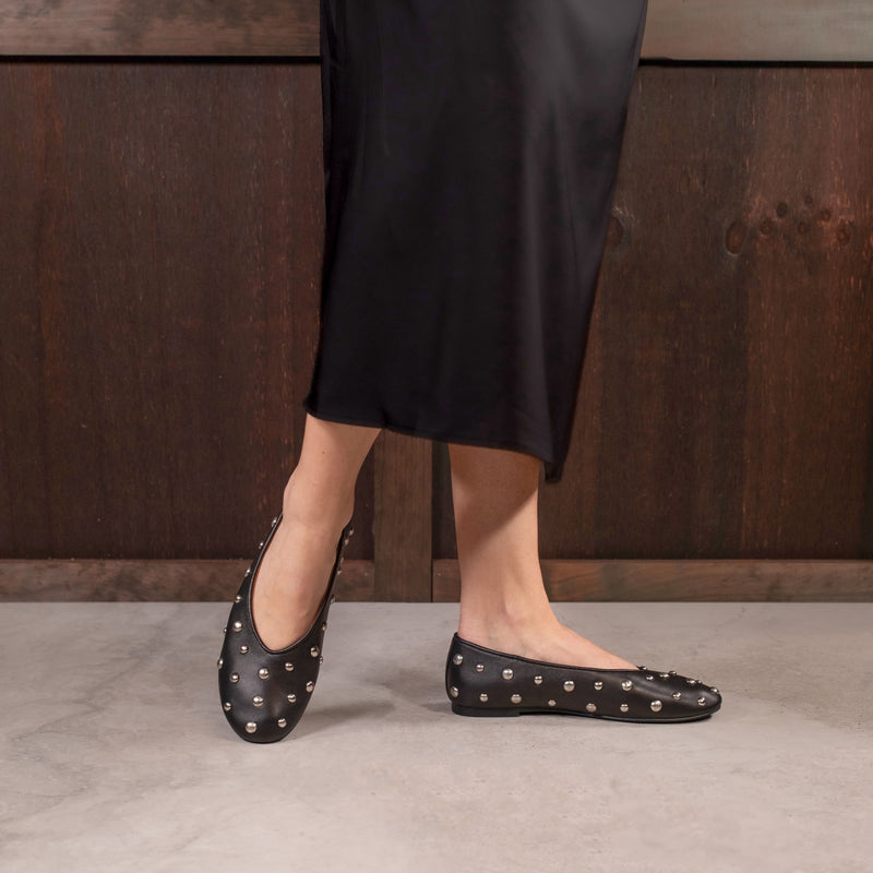 Black EOS Lune stud loafers with sleek design and stud accents, featuring smooth leather material and classic slip-on style.