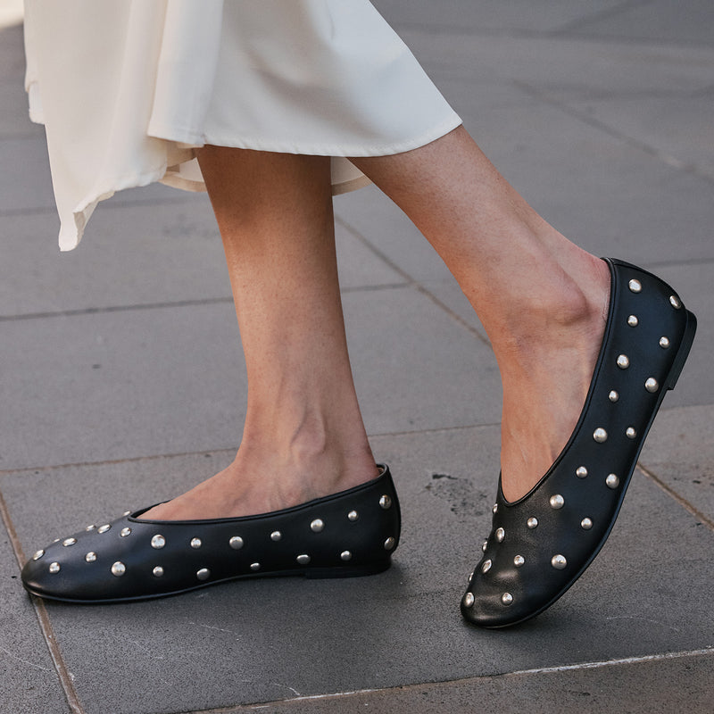 Close-up of EOS Lune Black Stud loafers showing the sleek black leather and stylish stud details on the upper.