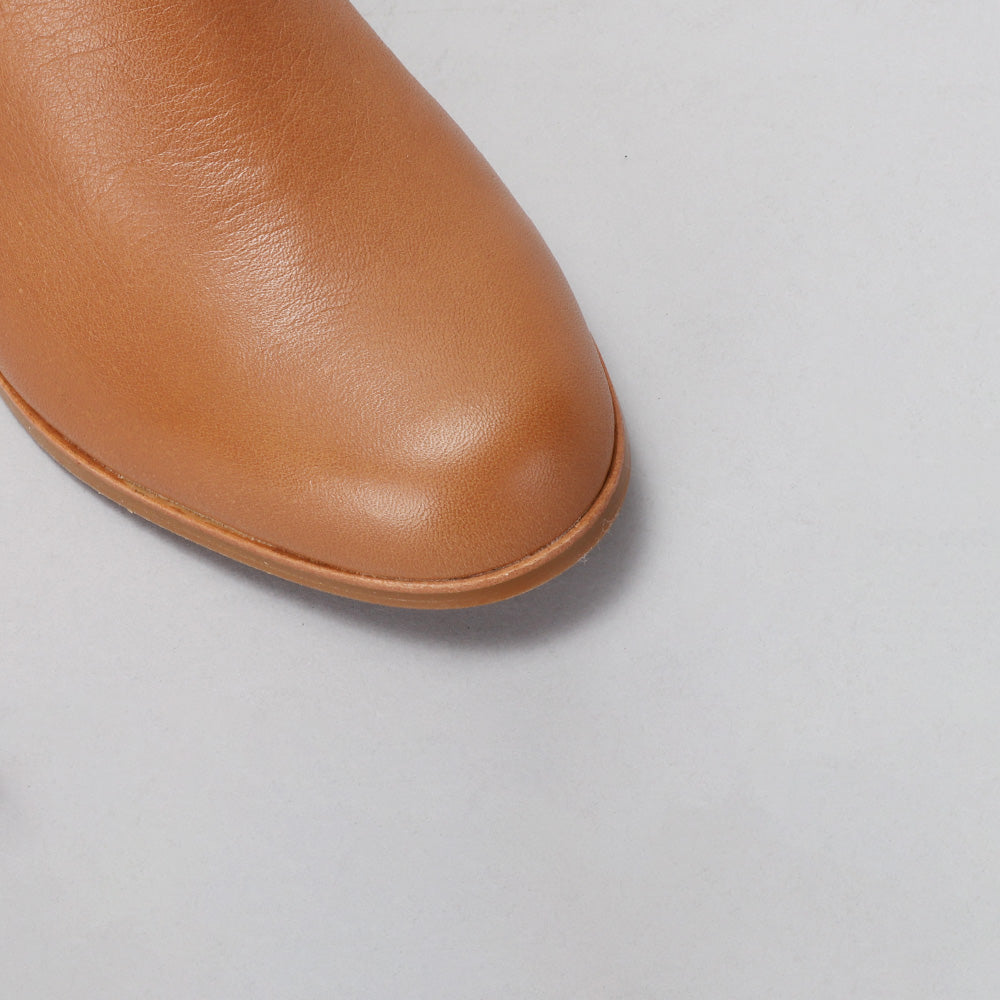 LE SANSA Mara Tan boots with a sleek, stylish design featuring a smooth tan leather finish and modern silhouette.