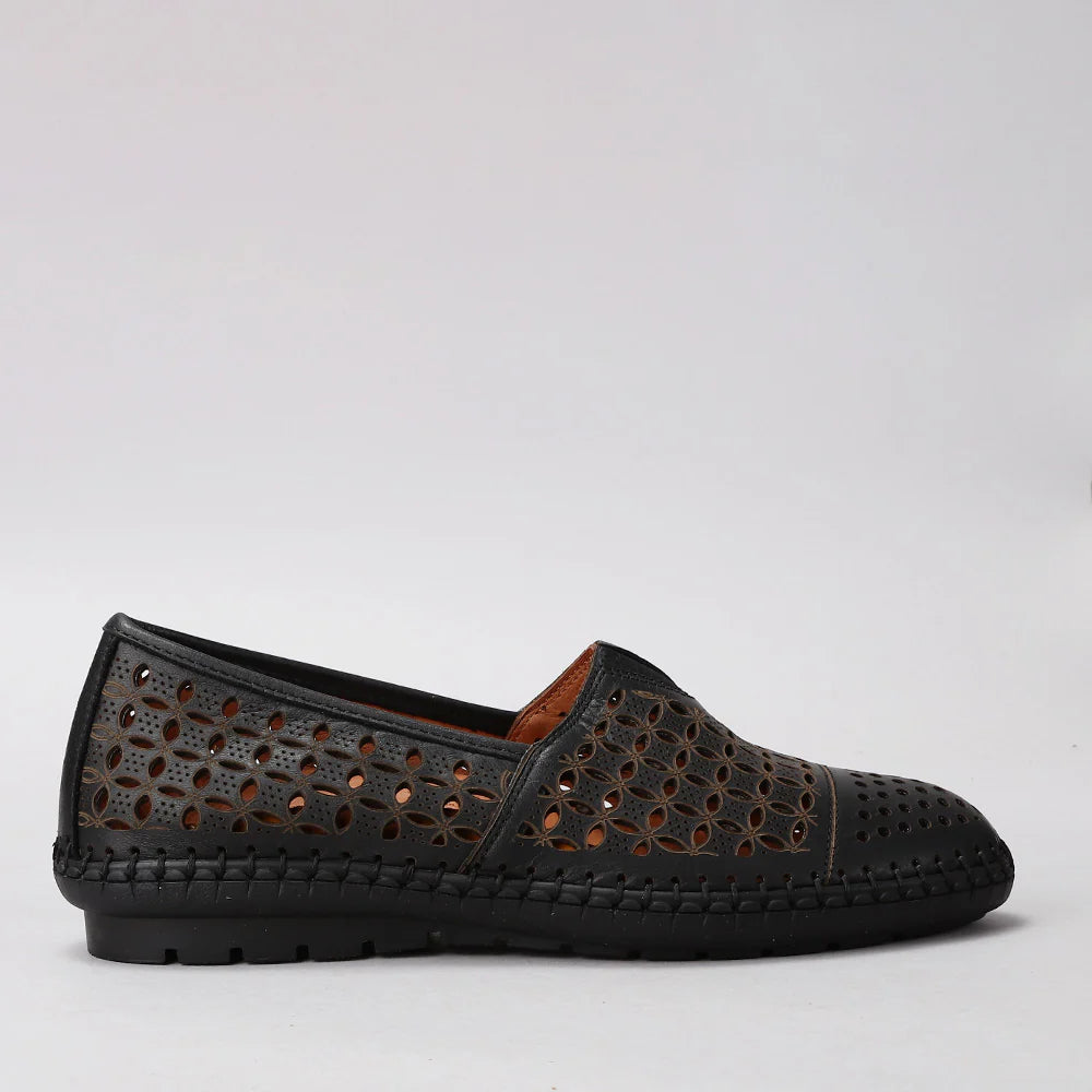 LE SANSA Mellow Black slip-on shoes with black fabric and sleek design, shown from the side view.