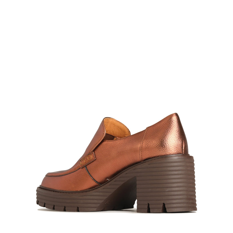 EOS Malia rust metallic heels showcasing a sleek design and glossy finish from an interior angle.