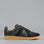 Black EOS Melbaa sneakers with sleek design and white sole, featuring laced closure and stylish athletic look.