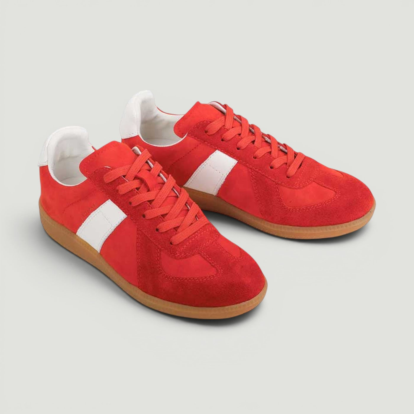 Red EOS Melbaa sneakers with a sleek design, featuring a smooth upper and comfortable sole for casual wear.