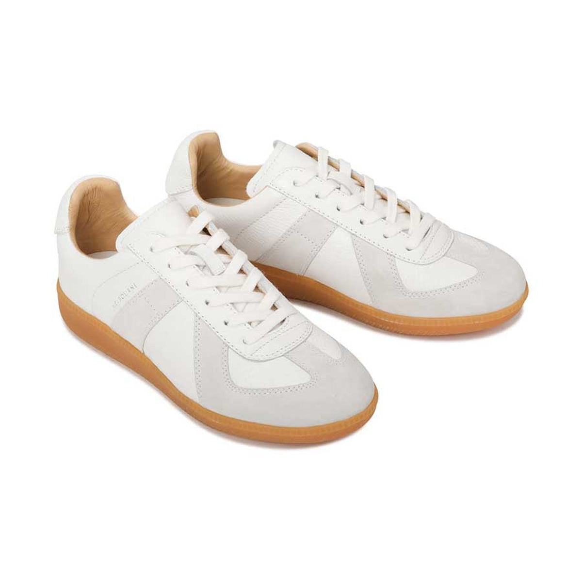 Eos Melbaa white sneakers with sleek design and white laces, showcasing a modern, stylish look for casual wear.