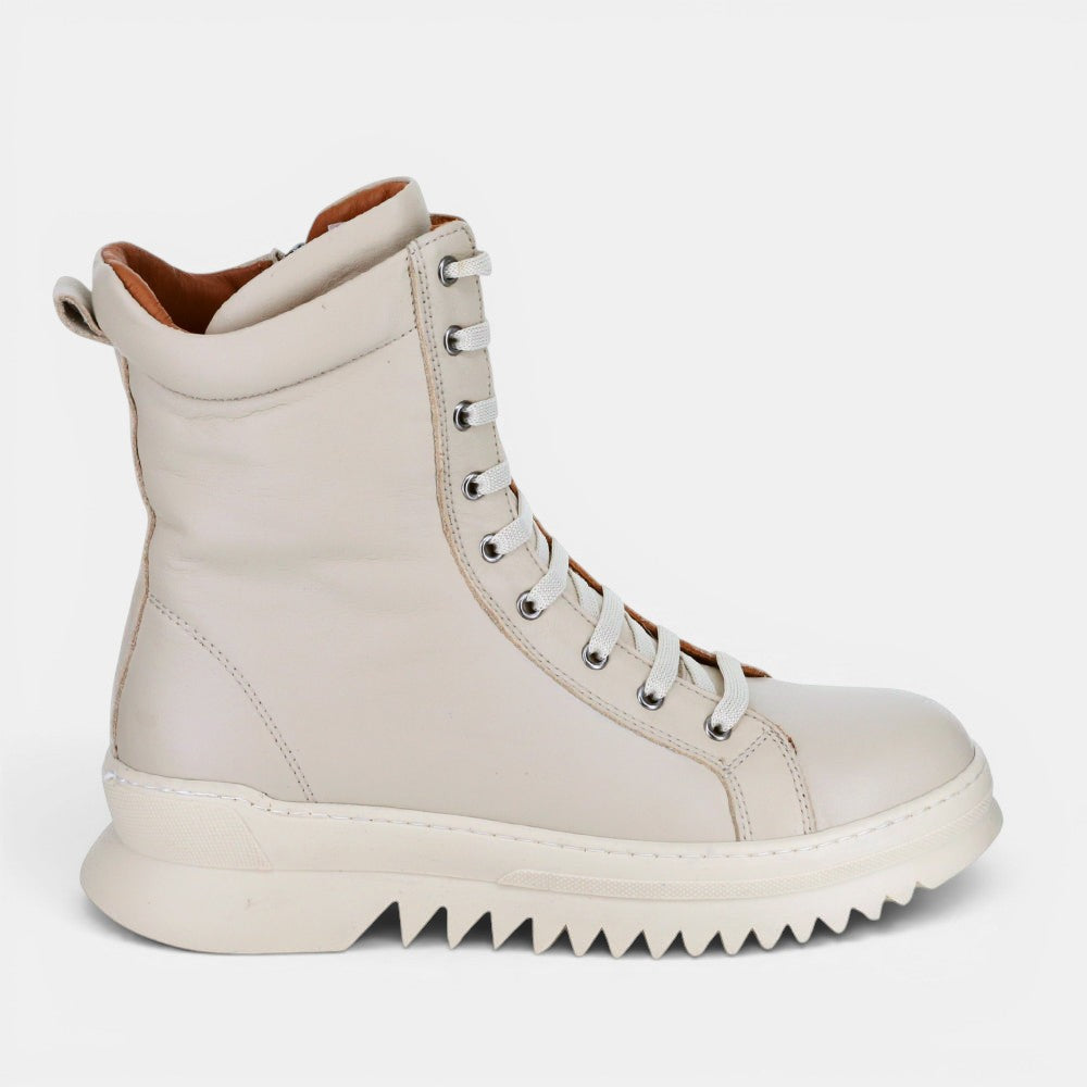 Beige LE SANSA Naomi boots with a sleek design, featuring pointed toes and ankle height, stylish for casual or dressy outfits.