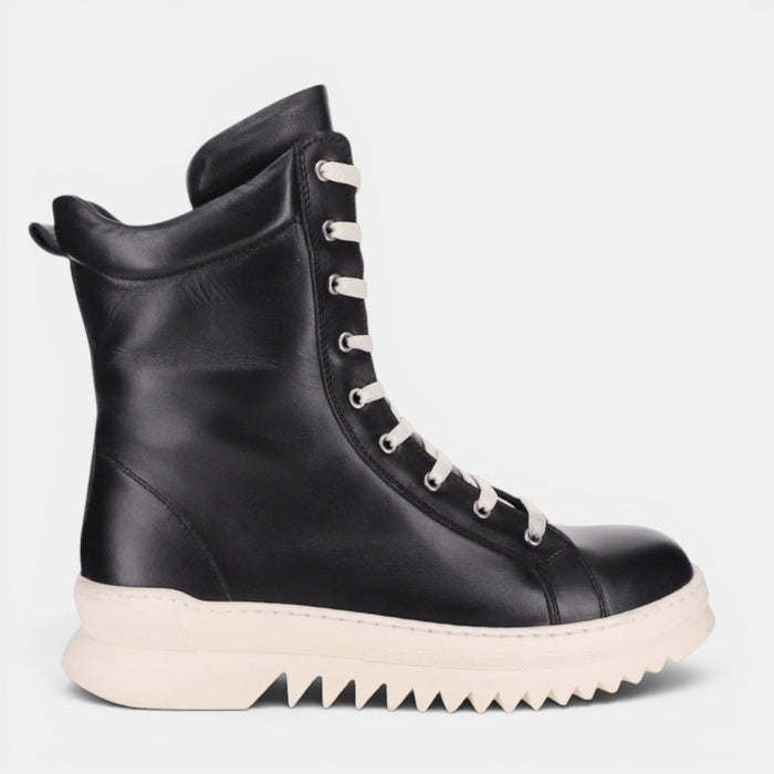 Black Le Sansa Naomi boots with side zipper and sleek design, stylish footwear for casual or dressy occasions.