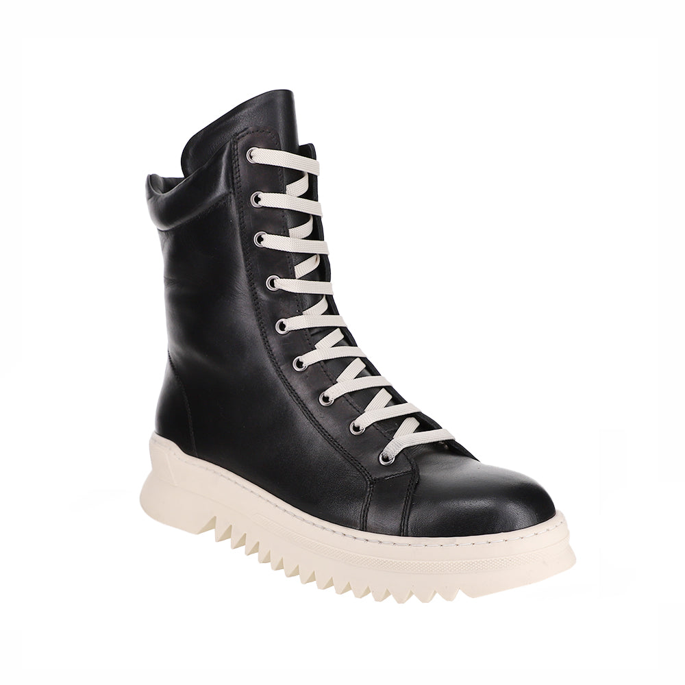 Black LE SANSA Naomi boots with sleek design and pointed toes, shown from the side view.