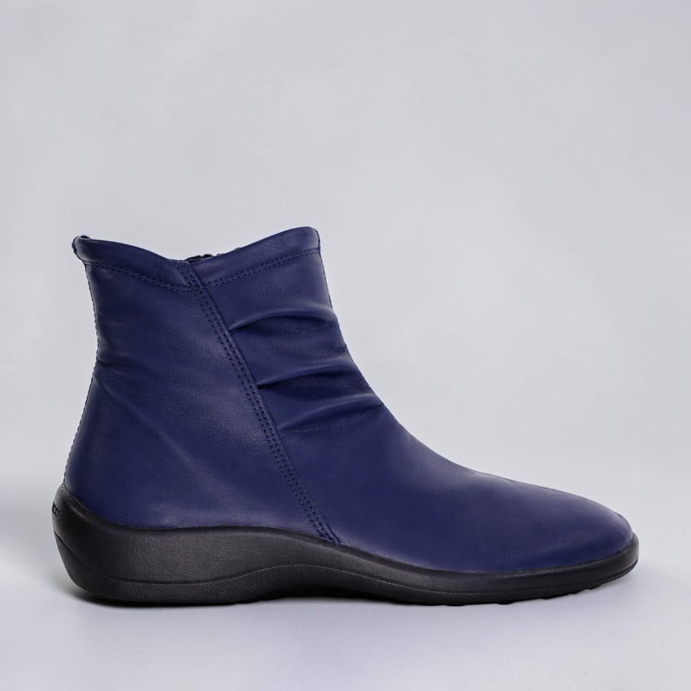 Arcopedico Paluma navy boots showcasing stylish design, ankle height, and comfortable fit with textured navy leather exterior.