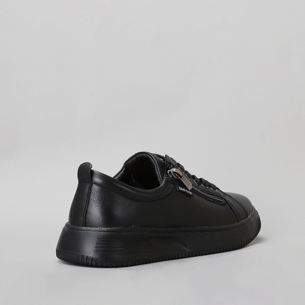 Naked Arches Nelly black sneakers with sleek black design and comfortable fit, shown from a side angle.