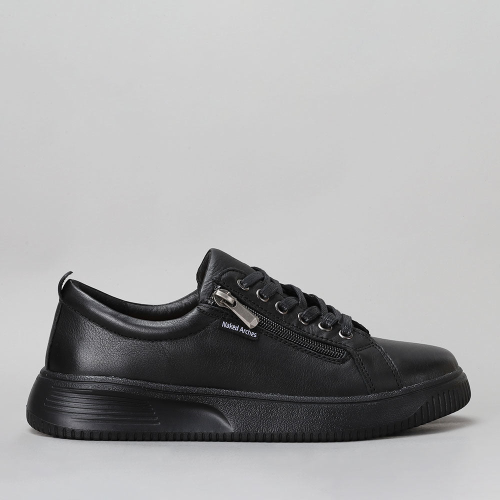 Naked Arches Nelly black sneakers with black soles, side view showing stylish design and comfortable fit.