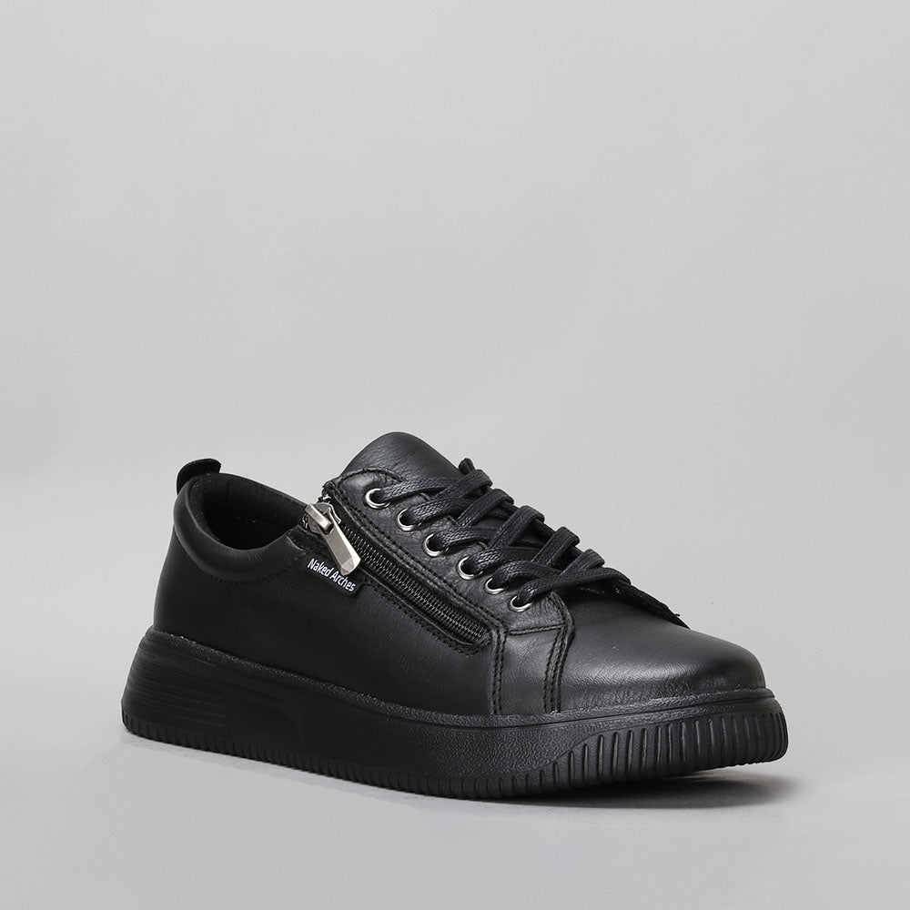 Naked Arches Nelly black sneakers with black soles, featuring a sleek, casual design and comfortable fit.