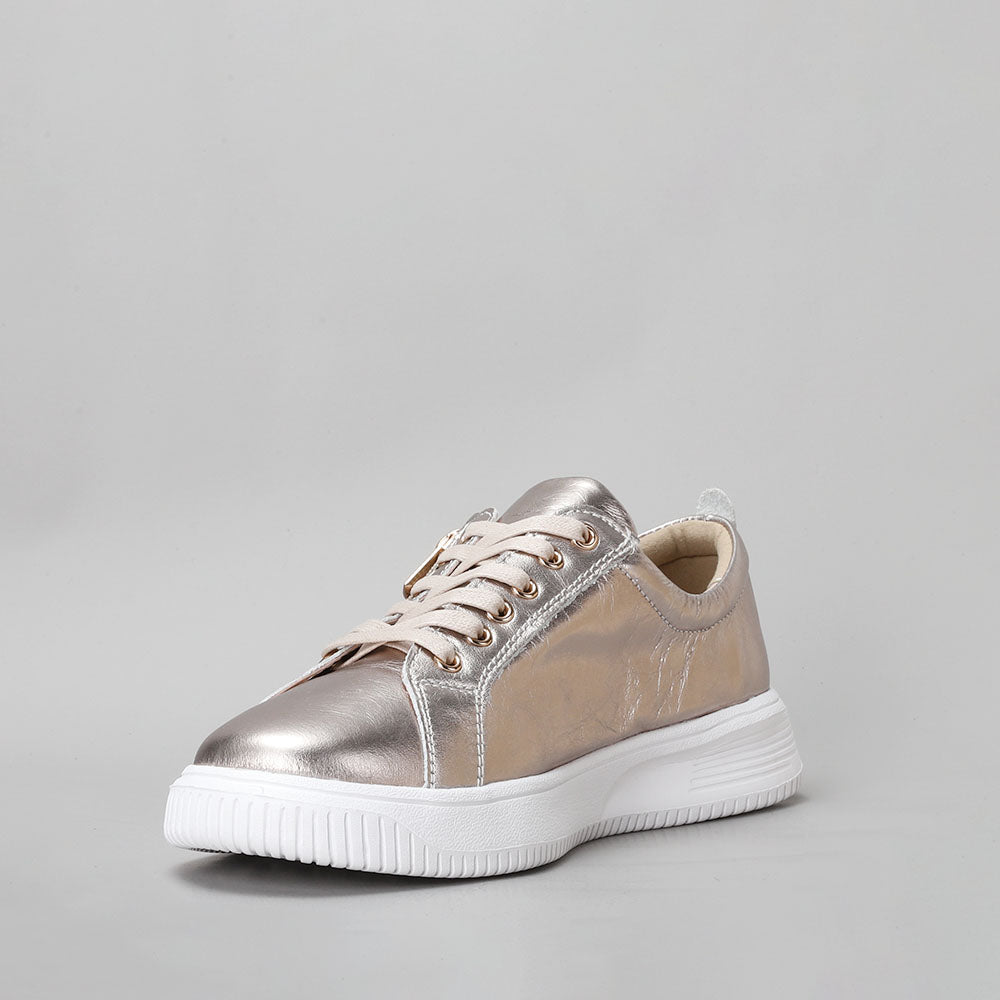 Naked Arches Nelly Champagne sneakers featuring a stylish champagne-colored design with a Southwestern pattern.